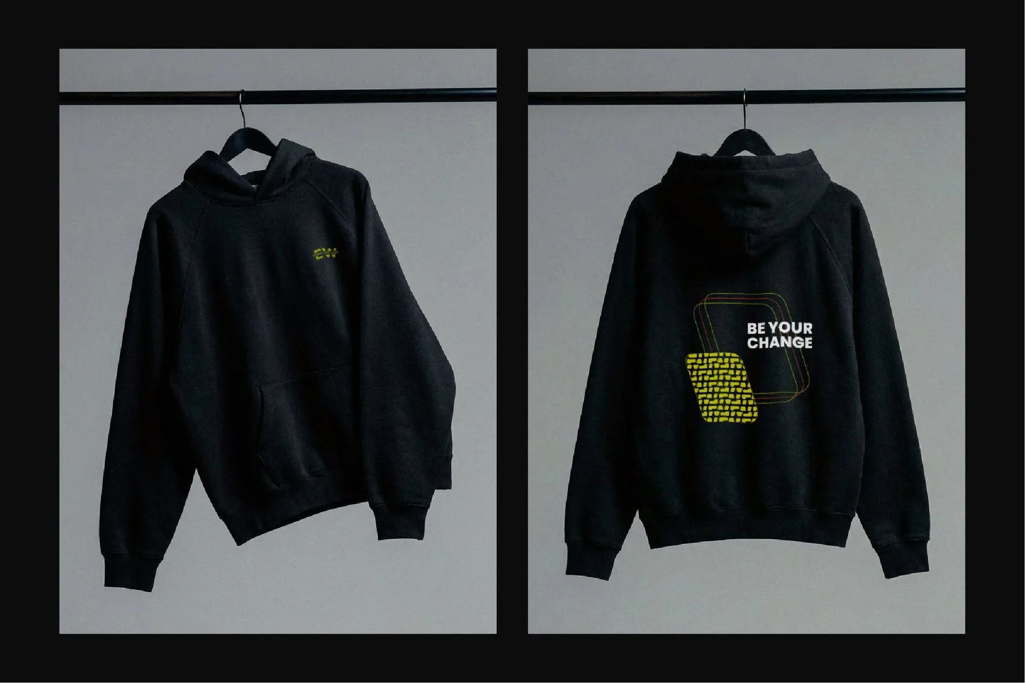 Felpa nera Etruria Wellness vista davanti col monogramma EW e dietro con la grafica Be Your Change in giallo-verde: concept di merchandising