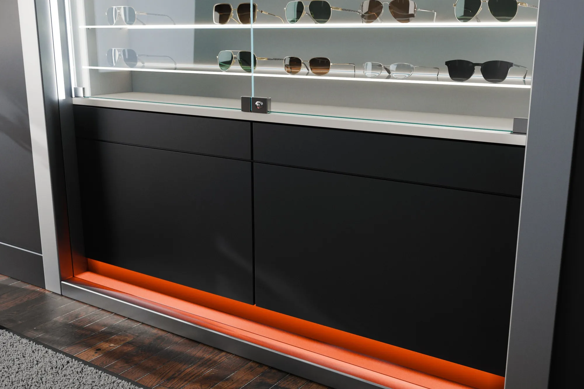 I cassetti neri a pressione e la fascia in plexi arancio Maybach illuminata, alla base dell'espositore: render 3D