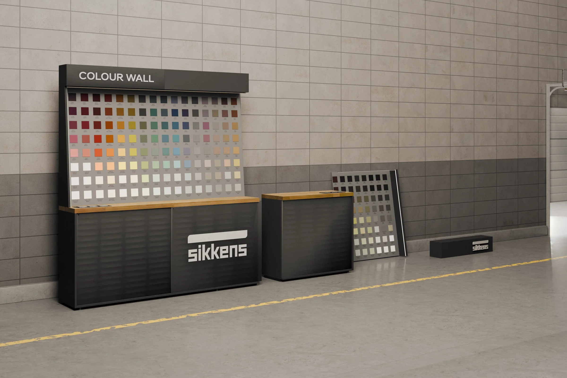 Il montaggio della Colour Wall Sikkens: la parete in piedi e accanto l'ultimo modulo a terra nei suoi tre blocchi, base, pannello dei colori e crowner. Render 3D