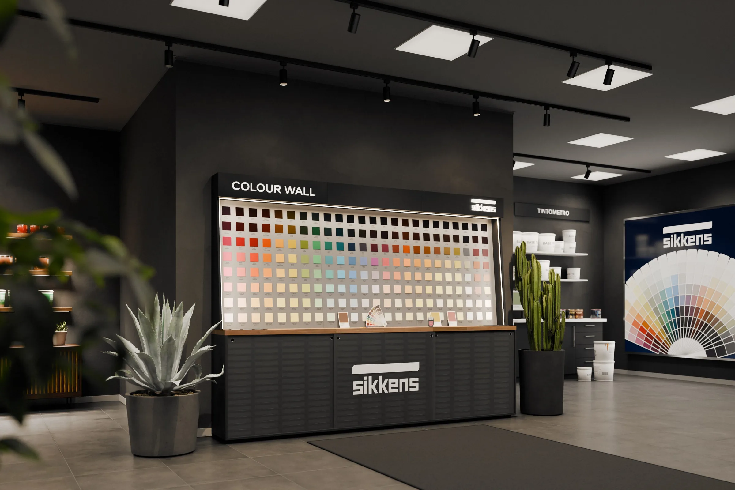 La Colour Wall Sikkens di tre quarti in un negozio di vernici: 192 campioni colore su tre moduli antracite, il piano in rovere e la scritta retroilluminata. Render 3D